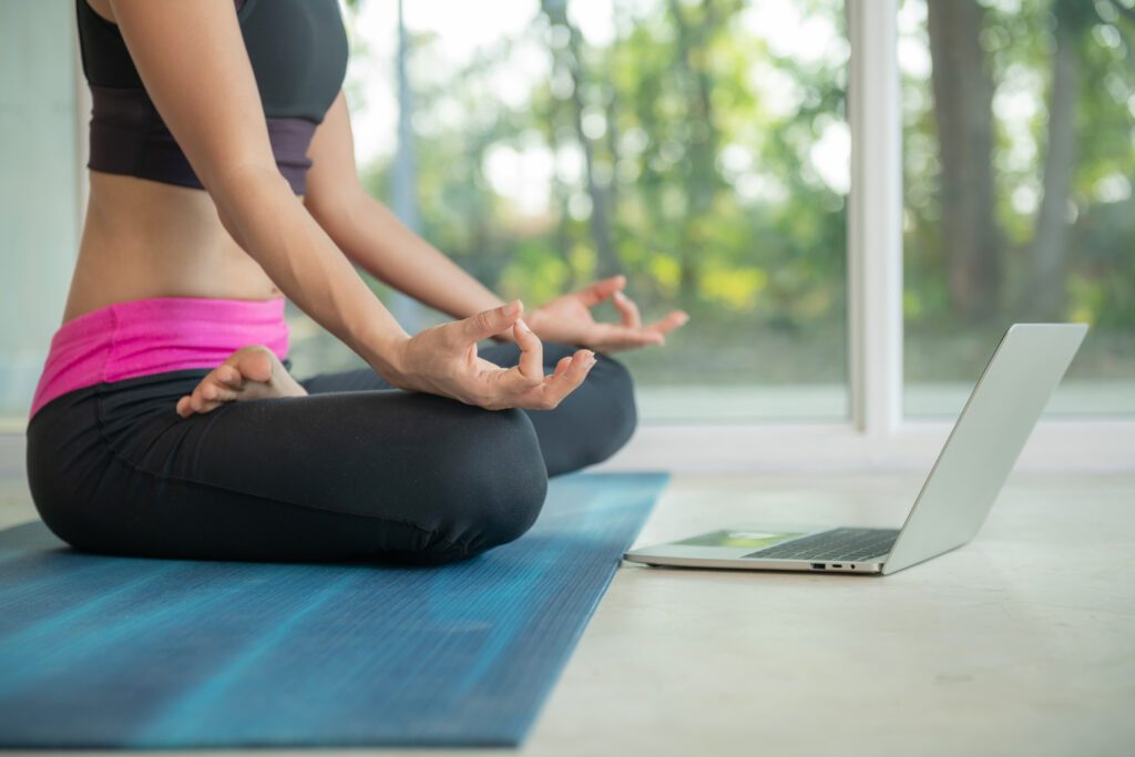 sporty woman practicing yoga, doing ardha padmasana exercise, me